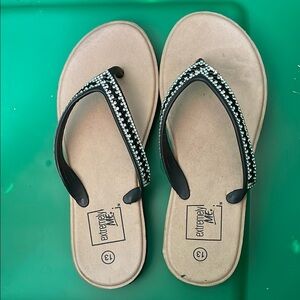 Elegant Black Sandals with Metallic Embellishments